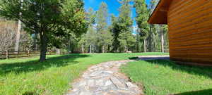 View of yard featuring fence