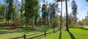 View of yard featuring fence