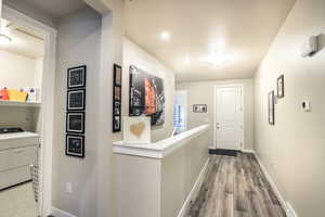 Corridor with an upstairs landing, LVP Flooring, front door entrance