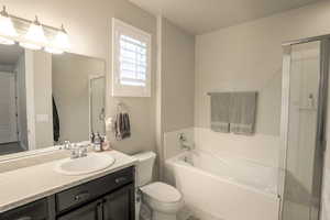 Primary bathroom with walk-in closet and separate tub and shower