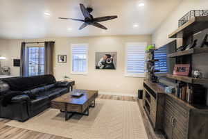 Living area featuring a ceiling fan, recessed lighting, LVP flooring