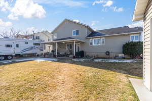 Exterior space with a patio and a front lawn