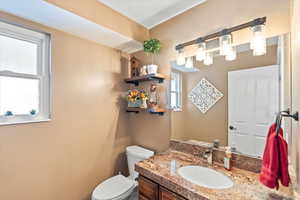 Bathroom with vanity and toilet