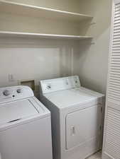 Laundry area featuring laundry area and independent washer and dryer