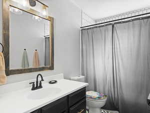 Bathroom with vanity and toilet