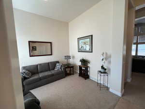 Formal living room featuring carpet flooring and baseboards