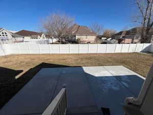 View of yard featuring a residential view, a fenced backyard, and a patio