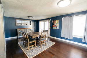 Dining area with bamboo flooring and French doors to patio