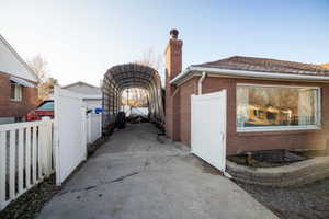 Gated and covered 14' high X 30' long RV parking