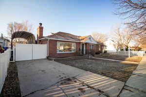 View of front with extra driveway and RV parking