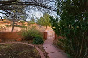 View of yard featuring a gate and fence