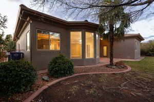 Back of house featuring a patio area and stucco siding