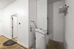 Laundry area with baseboards