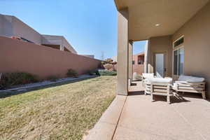 View of yard featuring a patio area, fence, and an outdoor area