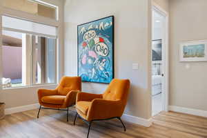 Living area with finished floors and baseboards