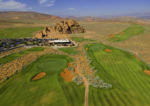 Bird's eye view with view of golf course and a mountain view