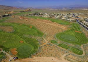 Aerial view featuring view of golf course and a mountain view