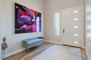 Entryway featuring baseboards and LVP floors