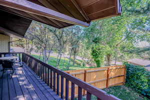 Wooden deck featuring fence