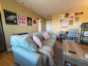 Living room featuring baseboards and wood finished floors