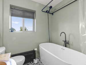 Soaking tub with shower attachment