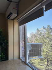 AC outside that connects to the mini-split. Also, new double pane picture window.