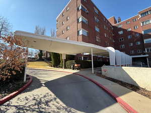 View of building exterior with the covered main entry