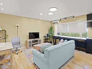 Living room with electric blinds closed about halfway