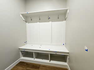 Mudroom with baseboards and wood finished floors