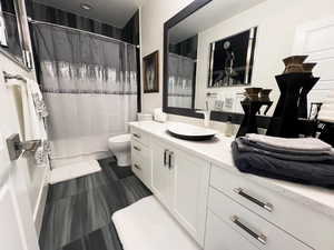 Full bath with vanity and toilet