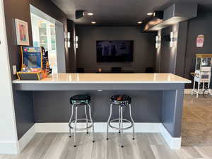 Bar featuring carpet, Theater , and recessed lighting