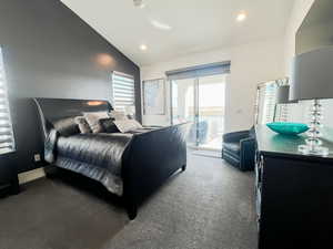 Bedroom featuring lofted ceiling, carpet floors, recessed lighting, and access to exterior