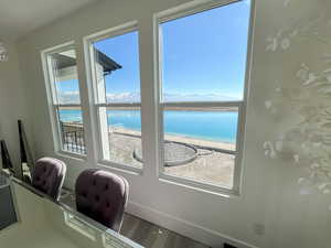 Interior space featuring a water view, LVP finished floors, and baseboards