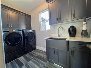 Laundry room with cabinet space, , separate washer and dryer area  and  sink