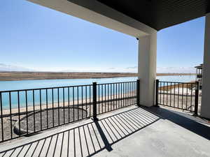 Balcony with a water and mountain view