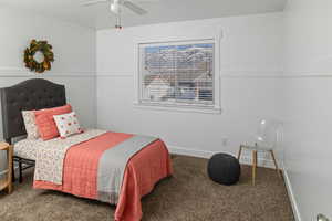 Bedroom with carpet flooring, a ceiling fan, and baseboards