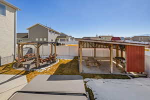 View of patio featuring a fenced backyard, a residential view, and a pergola