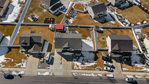 Snowy aerial view featuring a residential view