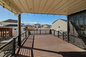 Deck featuring a residential view and a mountain view