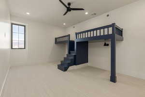 Unfurnished bedroom featuring recessed lighting, carpet floors, a ceiling fan, baseboards, and visible vents