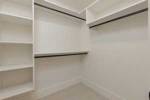 Spacious closet with carpet