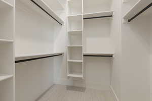 Spacious closet featuring carpet