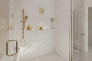 Bathroom with marble finish floor and a marble finish shower