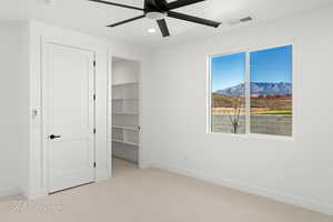 Unfurnished bedroom with light colored carpet, visible vents, baseboards, and recessed lighting