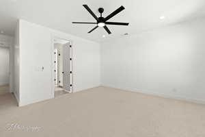 Unfurnished room featuring recessed lighting, baseboards, ceiling fan, and light colored carpet