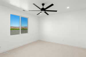 Unfurnished room featuring light carpet, baseboards, a ceiling fan, and recessed lighting