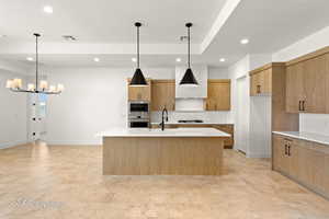 Kitchen with appliances with stainless steel finishes, recessed lighting, light countertops, and visible vents