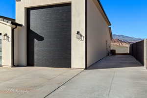 Exterior space featuring fence and a mountain view