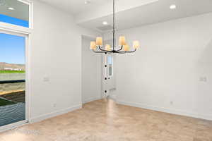 Unfurnished dining area with recessed lighting, visible vents, baseboards, and an inviting chandelier