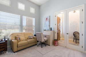 Home office featuring carpet flooring and french doors